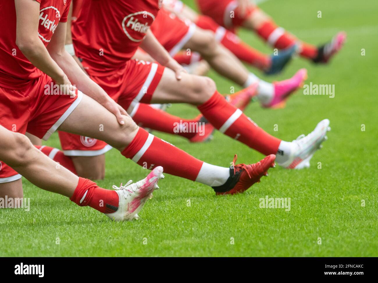 Duesseldorf, Germany. 16th May, 2021. Soccer: 2. Bundesliga, Fortuna Düsseldorf - Erzgebirge Aue, 33. matchday at Merkus Spiel-Arena: Fortuna's players stretch before the match. Credit: Bernd Thissen/dpa - IMPORTANT NOTE: In accordance with the regulations of the DFL Deutsche Fußball Liga and/or the DFB Deutscher Fußball-Bund, it is prohibited to use or have used photographs taken in the stadium and/or of the match in the form of sequence pictures and/or video-like photo series./dpa/Alamy Live News Stock Photo
