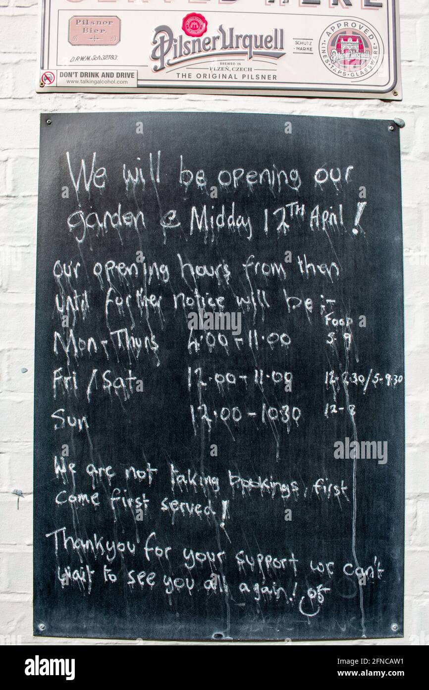 The Cambridge Blue has a chalkboard, though the rain has made the writing run, with details of its reopening once Covid 19 restrictions are lifted. Stock Photo