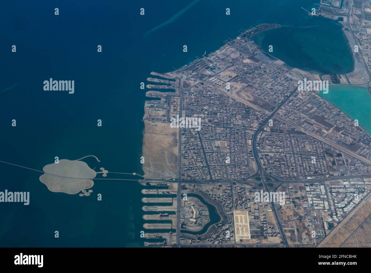 Al Khobar – Saudi Arabia, May 12, 2021: Aerial view showing the King Fahd Causeway from Bahrain to Saudi Arabia at the point in reaches the City of Al Stock Photo