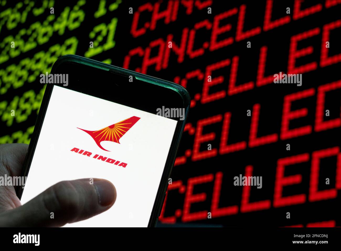 China. 23rd Apr, 2021. In this photo illustration the India flag carrier airline Air India logo is seen on an Android mobile device with a computer key which says cancel and cancelled. Credit: Budrul Chukrut/SOPA Images/ZUMA Wire/Alamy Live News Stock Photo