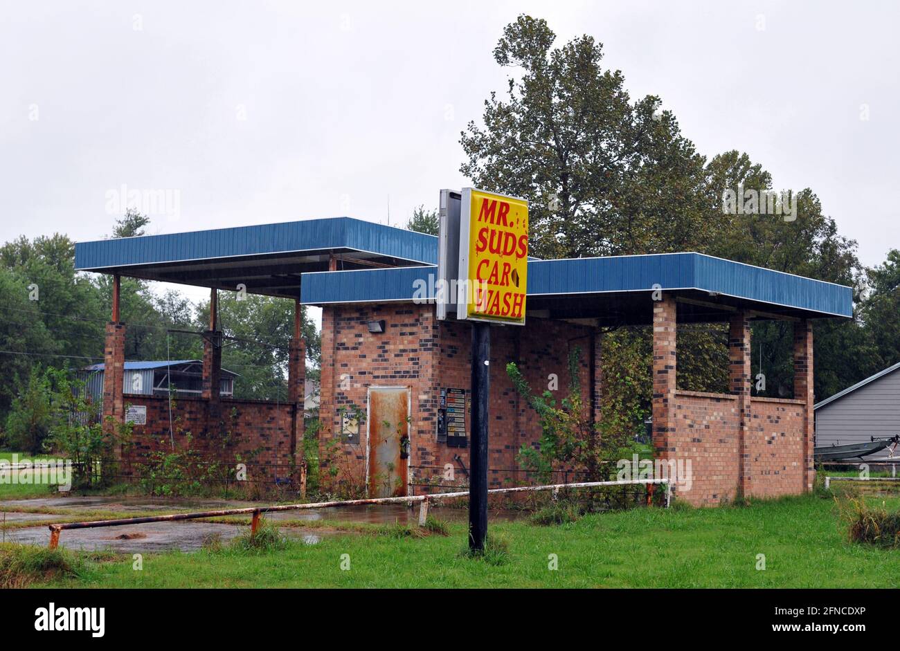 An abandoned, overgrown car wash in the Route 66 town of Afton, Oklahoma. Stock Photo