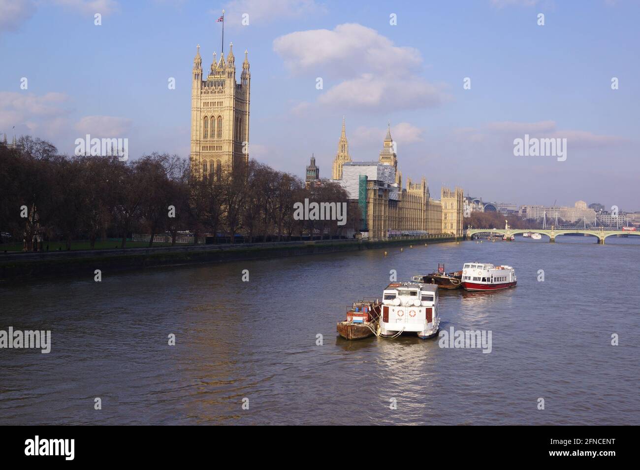 London, UK: boats on the River Thames, with Westminster Palace and Victoria Tower in the background Stock Photo