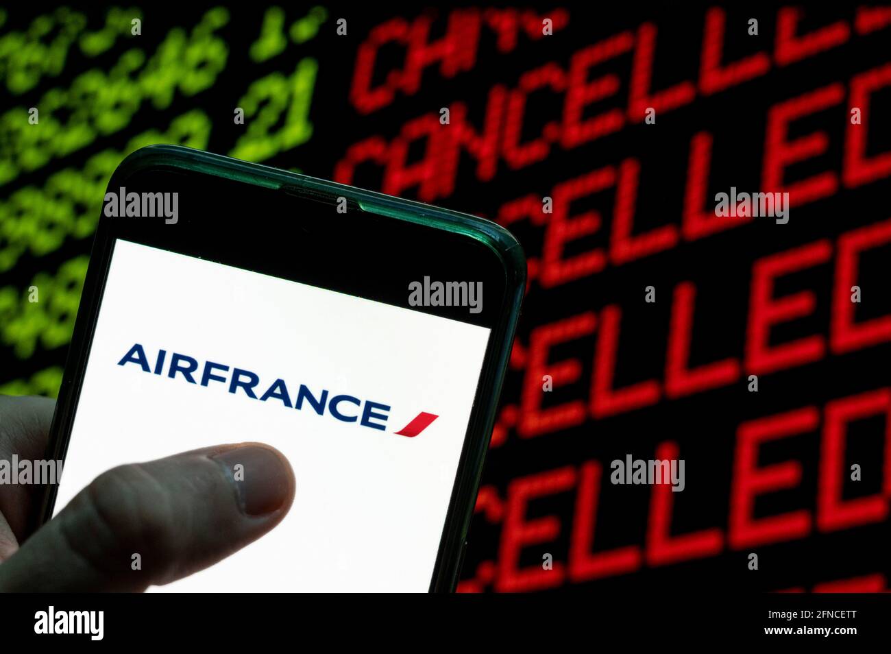 China. 23rd Apr, 2021. In this photo illustration the Franco-Dutch airline holding company Air France logo is seen on an Android mobile device with a computer key which says cancel and cancelled. Credit: Budrul Chukrut/SOPA Images/ZUMA Wire/Alamy Live News Stock Photo