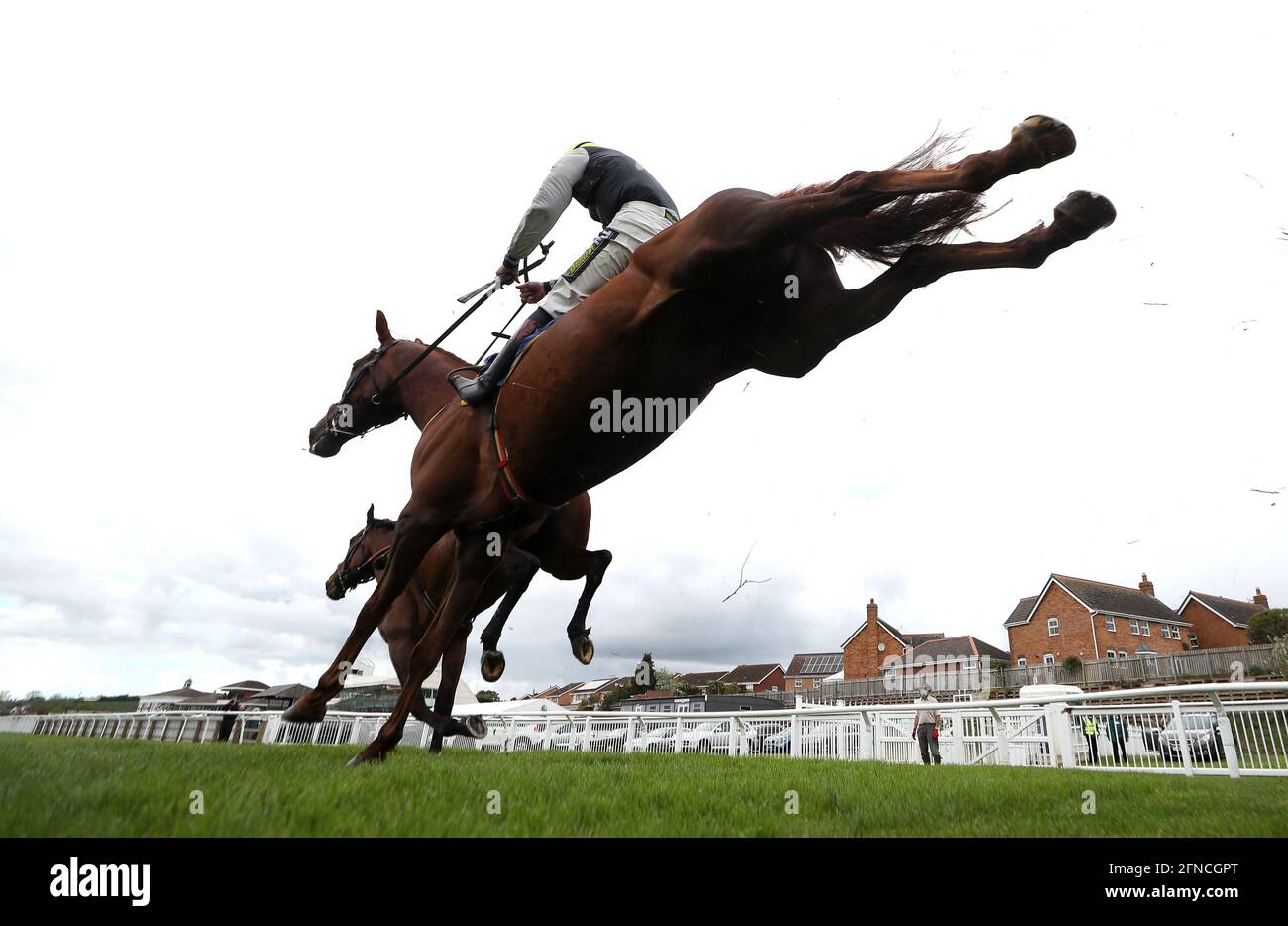 Atlantic Storm ridden by jockey Charlie Hammond (left hidden) on their way to winning the Visit racingtv.com Handicap Chase with Larch Hill ridden by jockey Sam Twiston-Davies second at Stratford-on-Avon Racecourse. Picture date: Sunday May 16, 2021. Stock Photo