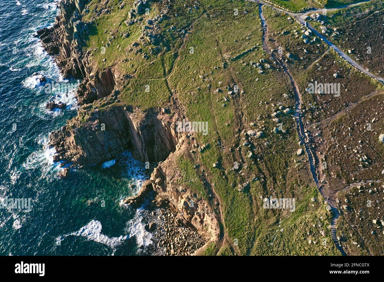 beautiful rugged coastline with cliffs and ocean, unique aerial coastal view taken at lands end Cornwall Stock Photo