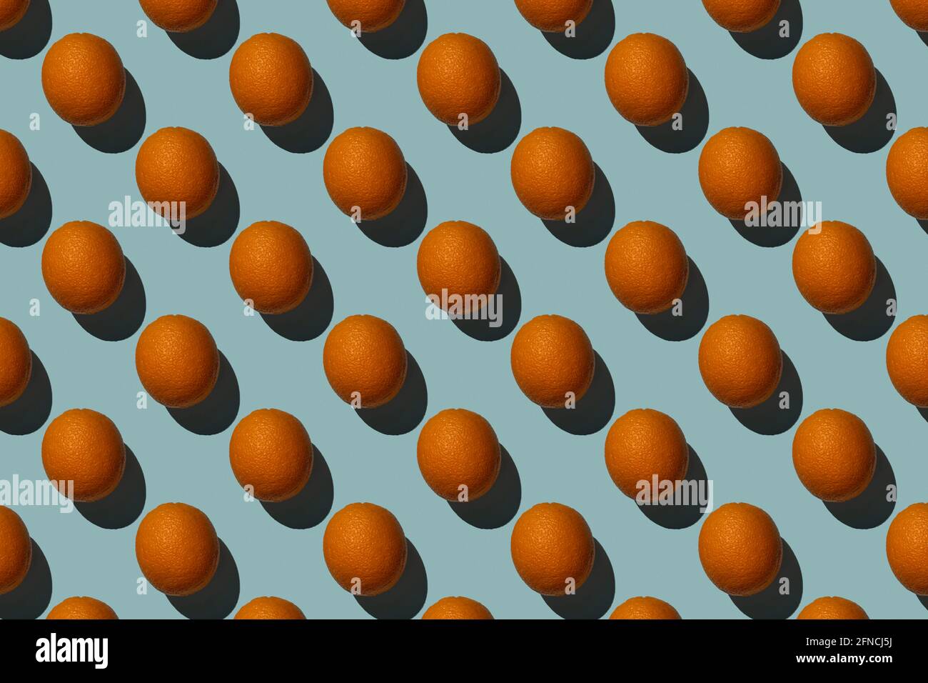 Brown eggs pattern on blue background Hard shadows Stock Photo