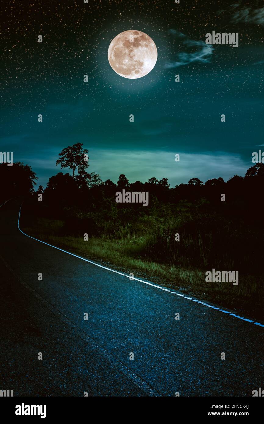 Beautiful landscape of dark sky with bright full moon and asphalt ...