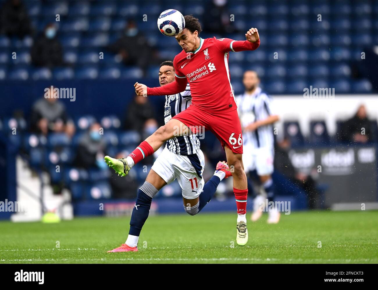 Liverpool's Trent Alexander-Arnold (right) and West Bromwich Albion's Grady Diangana battle for the ball during the Premier League match at The Hawthorns, West Bromwich. Picture date: Sunday May 16, 2021. Stock Photo