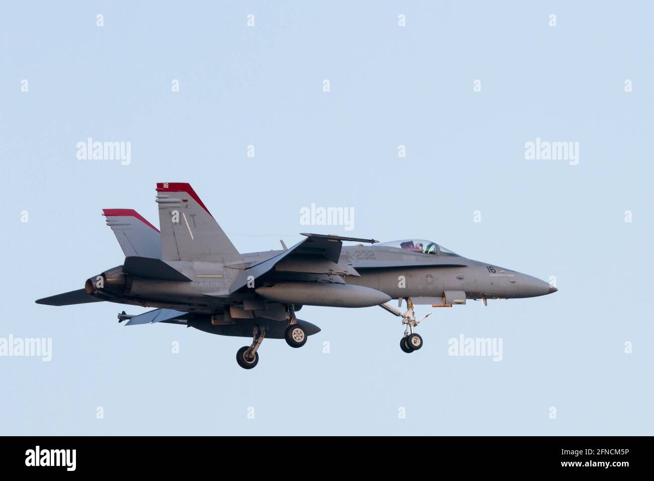 A McDonnell Douglas F/A-18c Hornet with the Marine Fighter Attack Squadron 232 (VMFA-232) known as The Red Devils flies near NAF Atsugi airbase in Kanagawa. Stock Photo