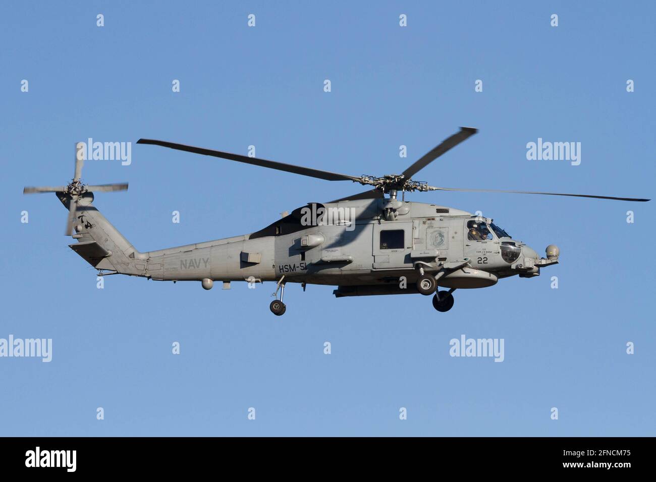 US Navy Sikorsky SH-60 Seahawk with the Helicopter Maritime Strike Squadron Five-One (HSM-51) flies near Naval Air Facility in Kanagawa. Stock Photo