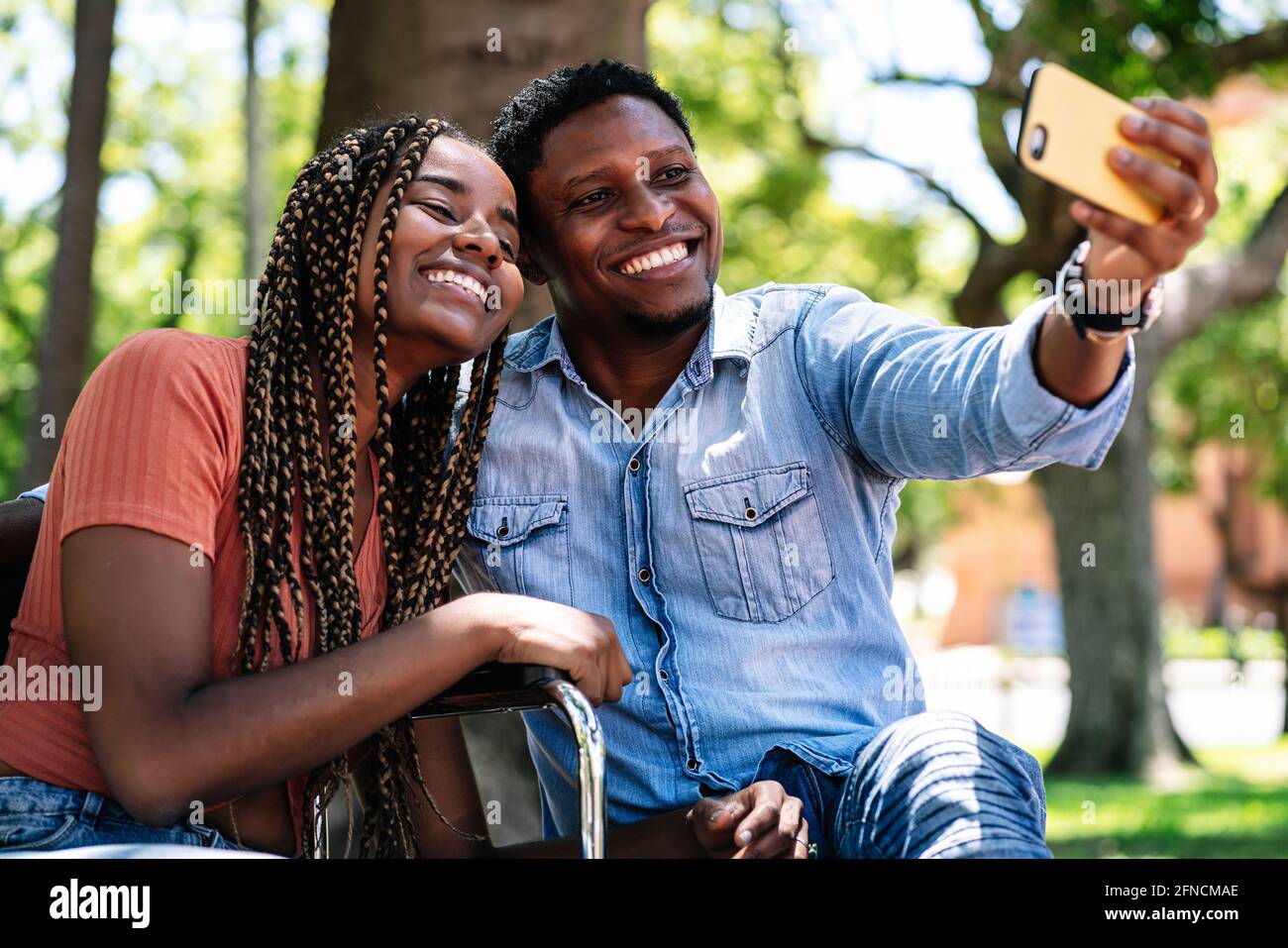 Woman in a wheelchair taking a selfie with her boyfriend Stock Photo ...