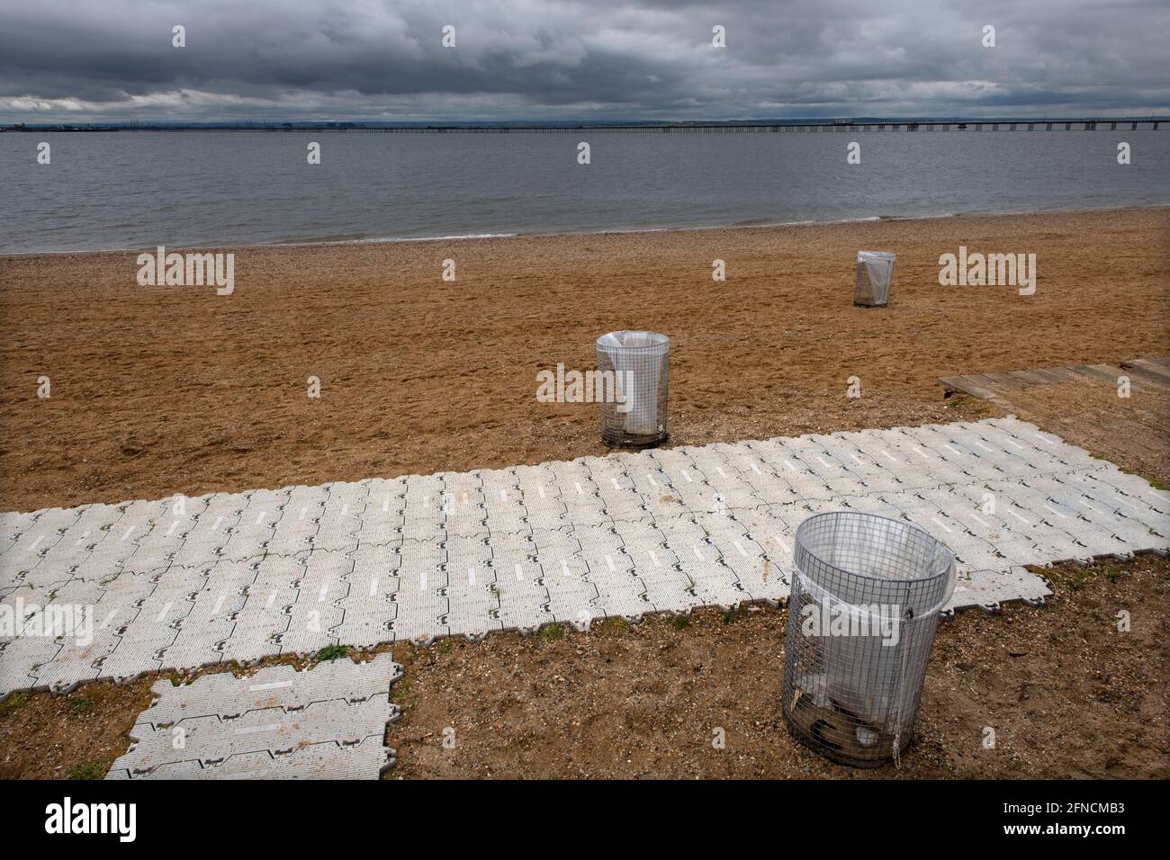 Southend on Sea Essex England UK 15 May 2021 Rubbish bins on the clean beach waiting for Covid restrictions to be lifted Stock Photo