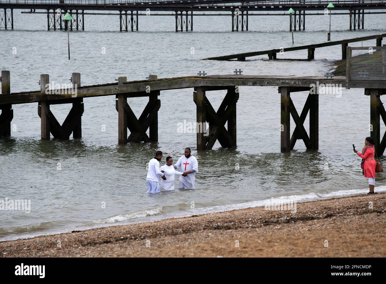 Southend on Sea Essex England UK 15 May 2021 Full body emersion baptism in the Thames Estuary at Southend Stock Photo