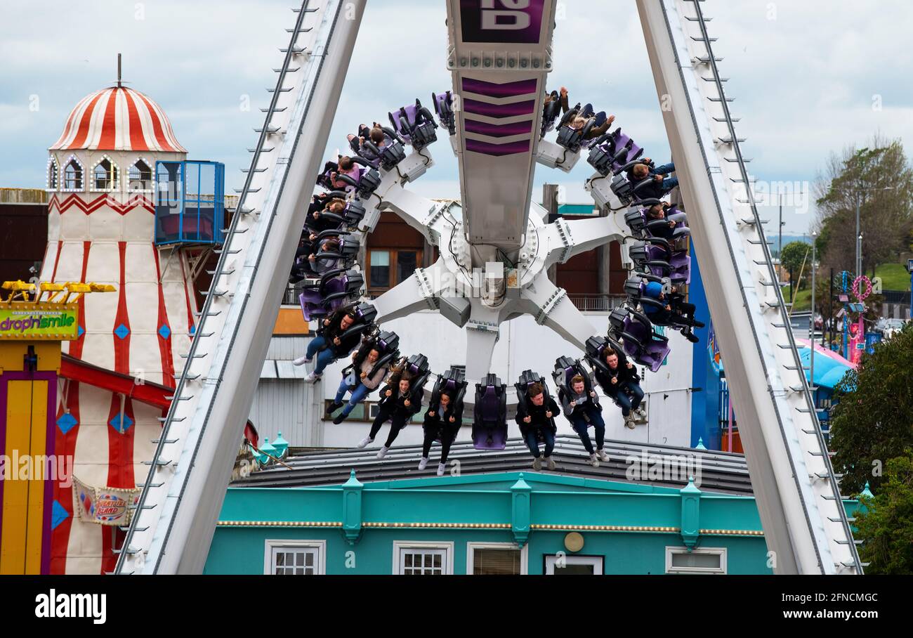 Southend on Sea Essex England UK 15 May 2021 Visitors to Adventure Land enjoy the thrill of Axis one of the newest rides in the park on Southend Seafr Stock Photo