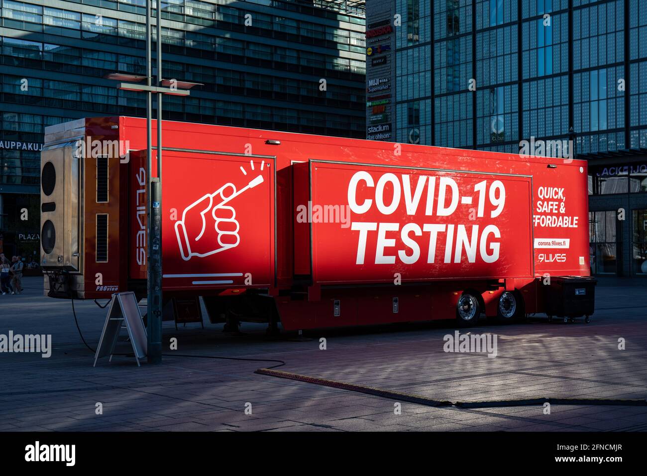 Mobile COVID-19 testing point or trailer or truck at Narinkkatori in Kamppi district of Helsinki, Finland Stock Photo