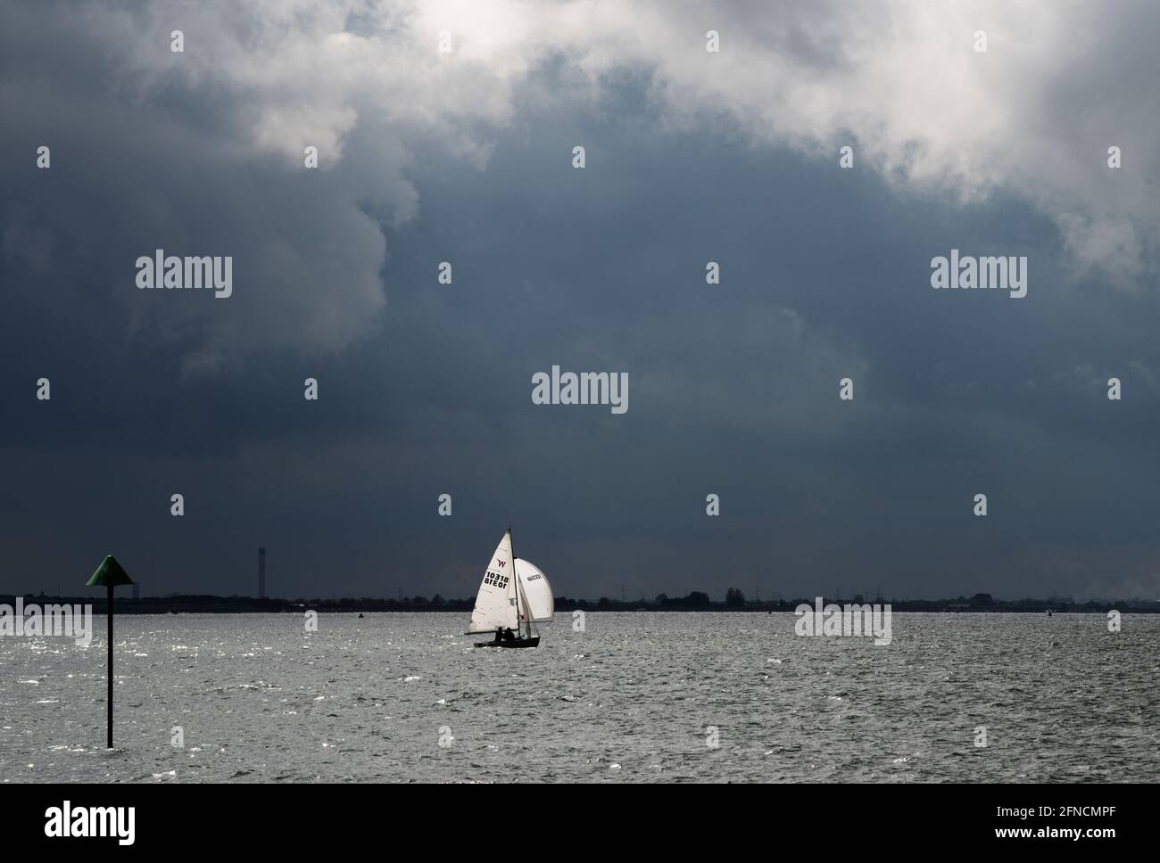 Southend on Sea Essex England UK 15 May 2021 Yacht sailing on the Thames Estuary under a threatening sky at Southend on Sea. Stock Photo