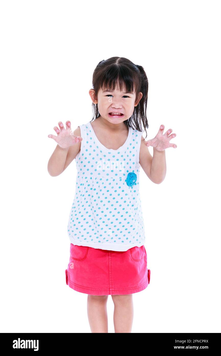 Angry girl growls, funny emotional. Lovely asian girl frighten somebody, hands are menacingly lifted and mouth grin. Trick or treat concept for hallow Stock Photo