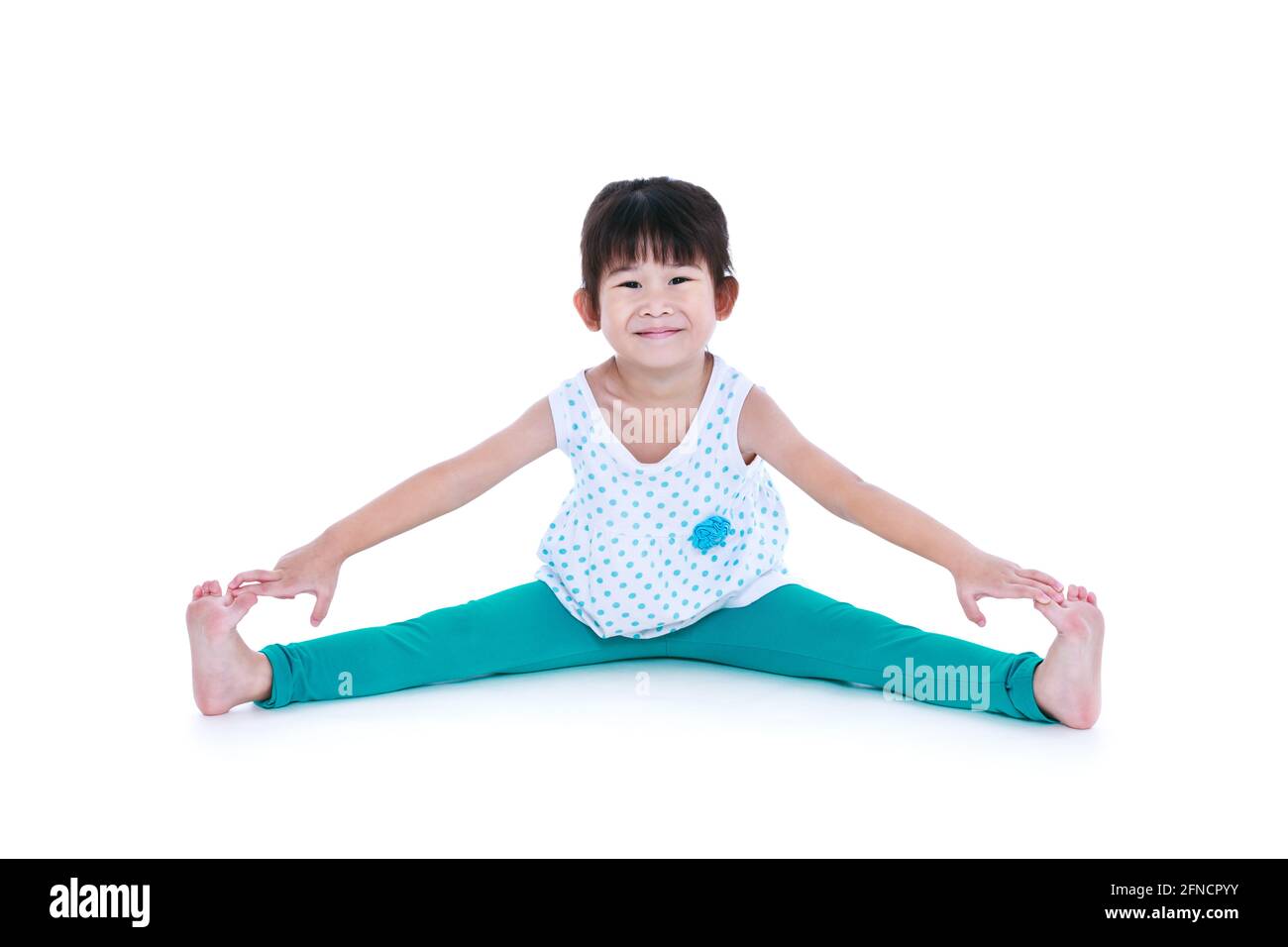 Little cute girl practicing yoga pose, isolated on white :: Stock