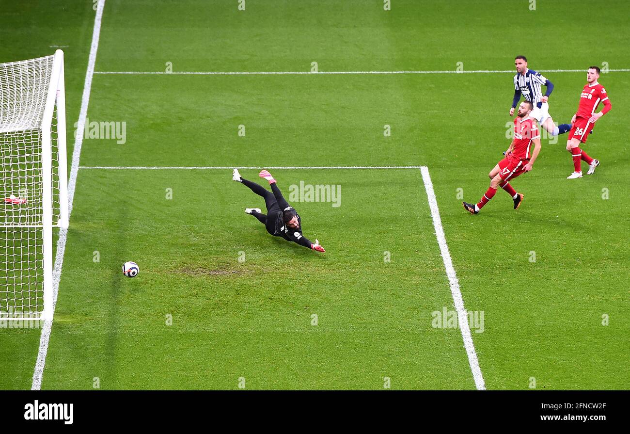 West Bromwich Albion's Hal Robson-Kanu scores their side's first goal of the game past Liverpool goalkeeper Alisson during the Premier League match at The Hawthorns, West Bromwich. Picture date: Sunday May 16, 2021. Stock Photo