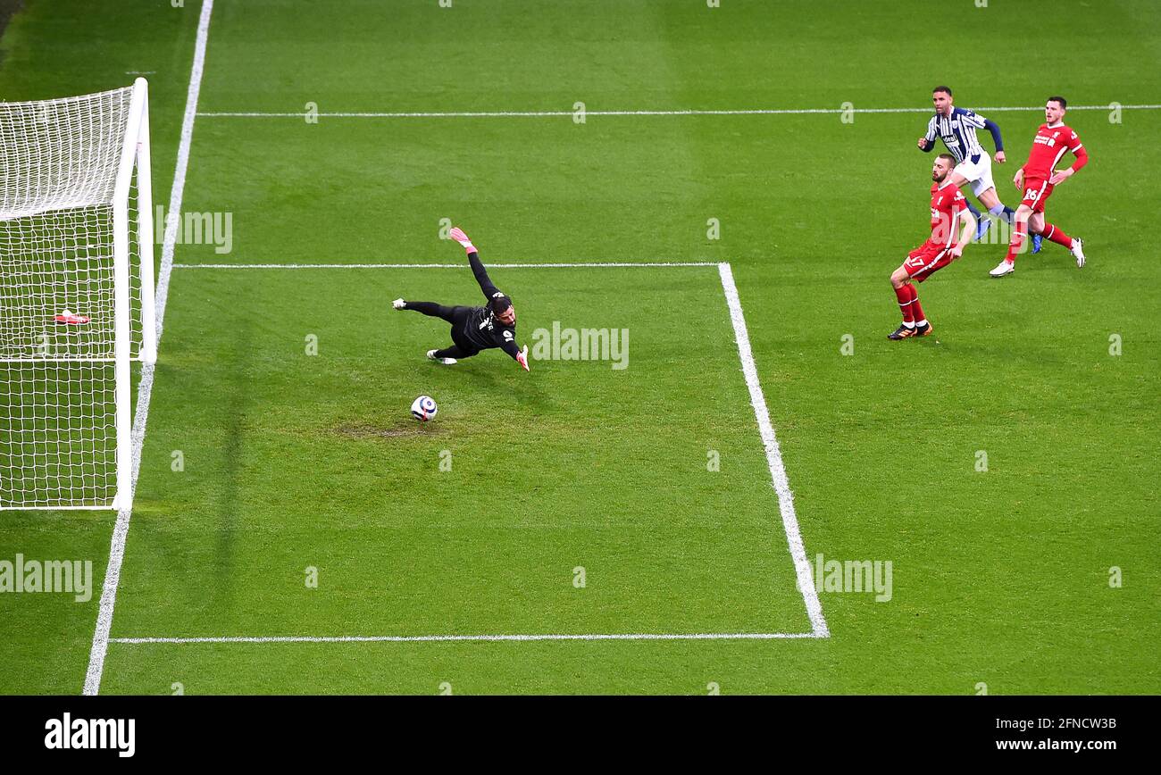 West Bromwich Albion's Hal Robson-Kanu scores their side's first goal of the game past Liverpool goalkeeper Alisson during the Premier League match at The Hawthorns, West Bromwich. Picture date: Sunday May 16, 2021. Stock Photo