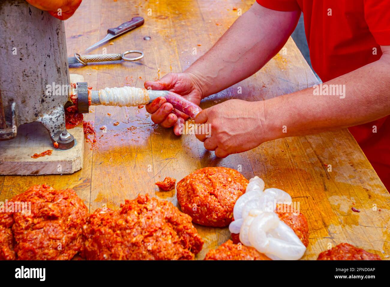 Fill up pig intestines to make sausage with machine for handmade