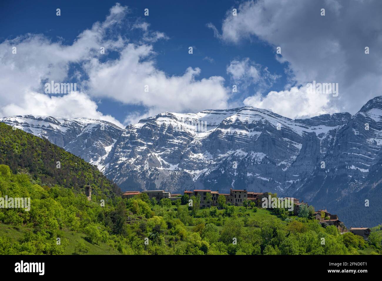 Serra de Cadí and the village of Arsèguel in the foreground, on a spring afternoon (Alt Urgell, Catalonia, Spain, Pyrenees) Stock Photo