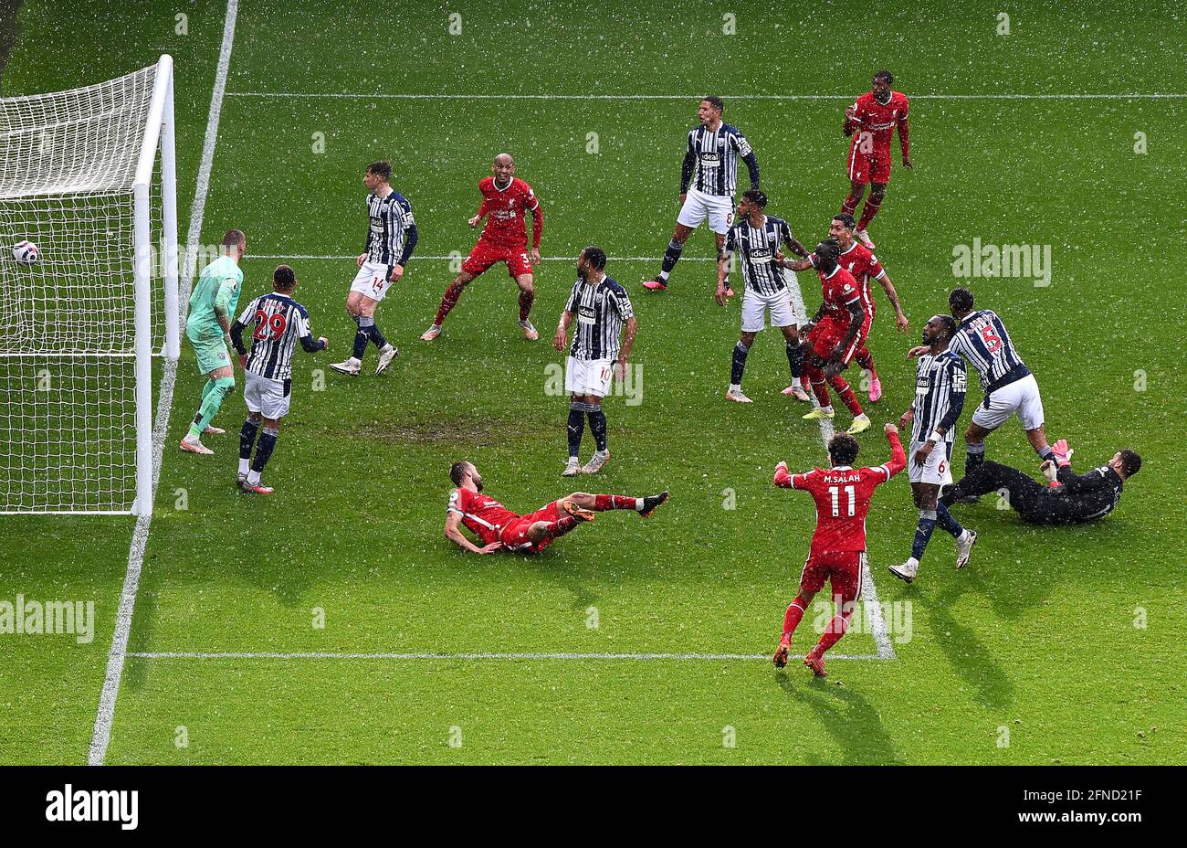 Liverpool goalkeeper Alisson (right) scores their side's second goal of the game during the Premier League match at The Hawthorns, West Bromwich. Picture date: Sunday May 16, 2021. Stock Photo