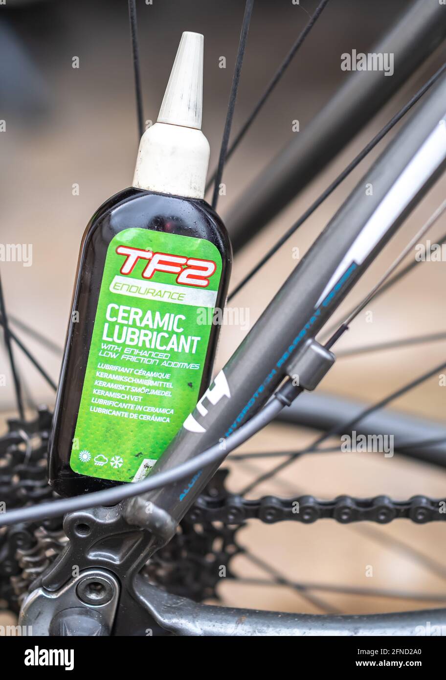Norwich, Norfolk, UK - May 15 2021. Close and selective focus on TF2 all  weather lubricant used to maintain and service the drive chain of a road  bike Stock Photo - Alamy