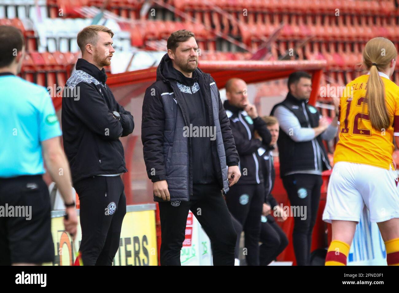Airdrie, North Lanarkshire, 16th May 2021. Motherwell Women FC Coach, Stewart Hall & Motherwell Women FC Goal Keeper Coach, Iain McKay look on during the Scottish Building Society Scottish Women's Premier League 1 Fixture Motherwell FC Vs Hibernian FC, Penny Cars Stadium, Airdrie, North Lanarkshire, 16th May 2021 | Credit Colin Poultney |  Credit: Colin Poultney/Alamy Live News Stock Photo