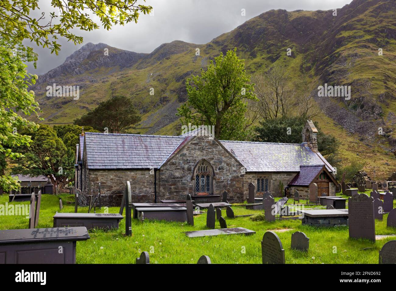 St Peris Church in the village Nant Peris, Snowdonia, North Wales, dates from at least the 14th century. Stock Photo