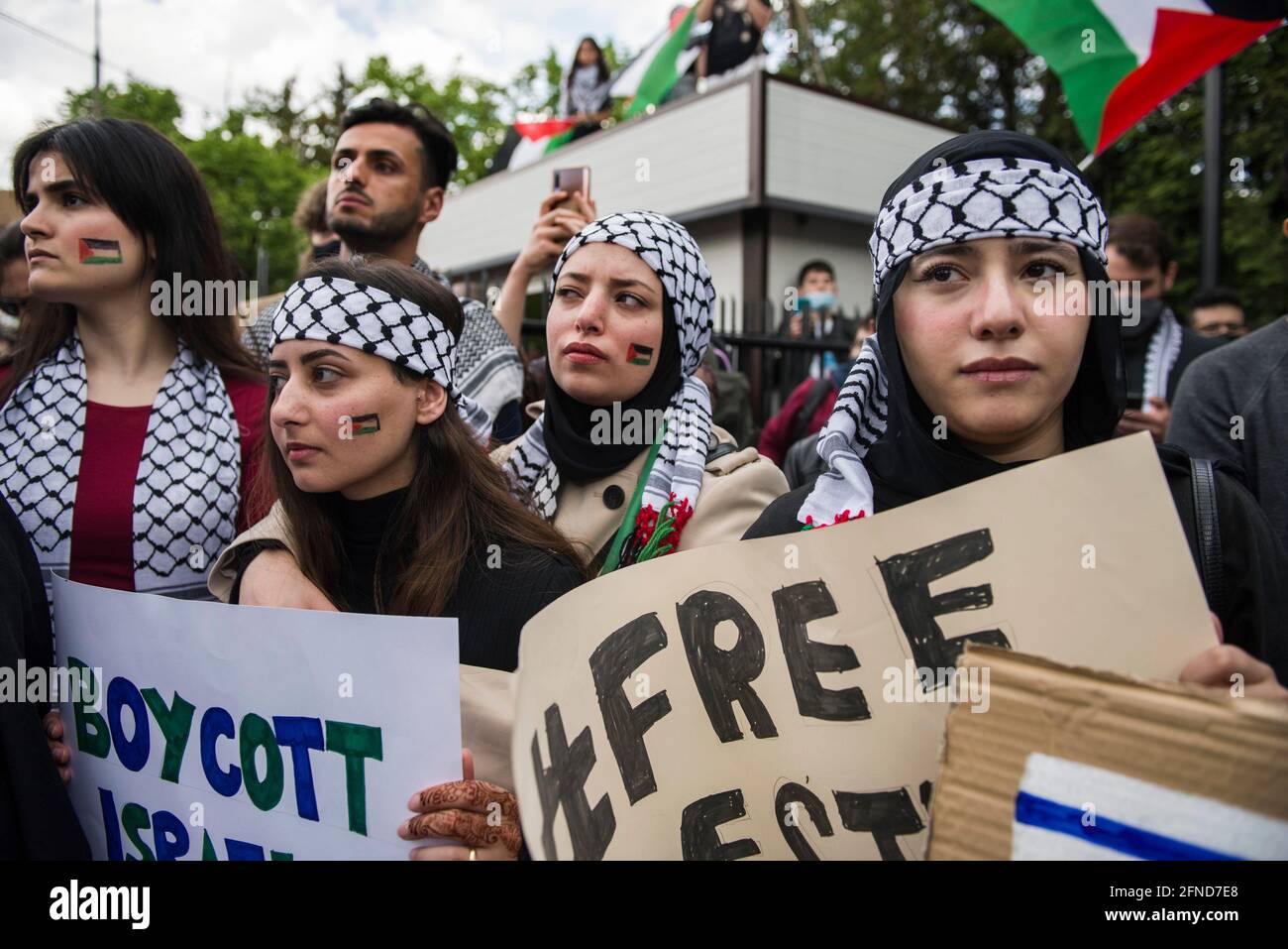 Palestinian Faecs Protesters with Palestinian flags printed in their faces during the ...
