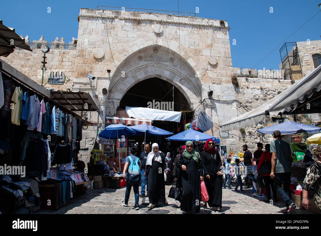 People walking Damascus Gate in the Muslim Quarter of the Old City of