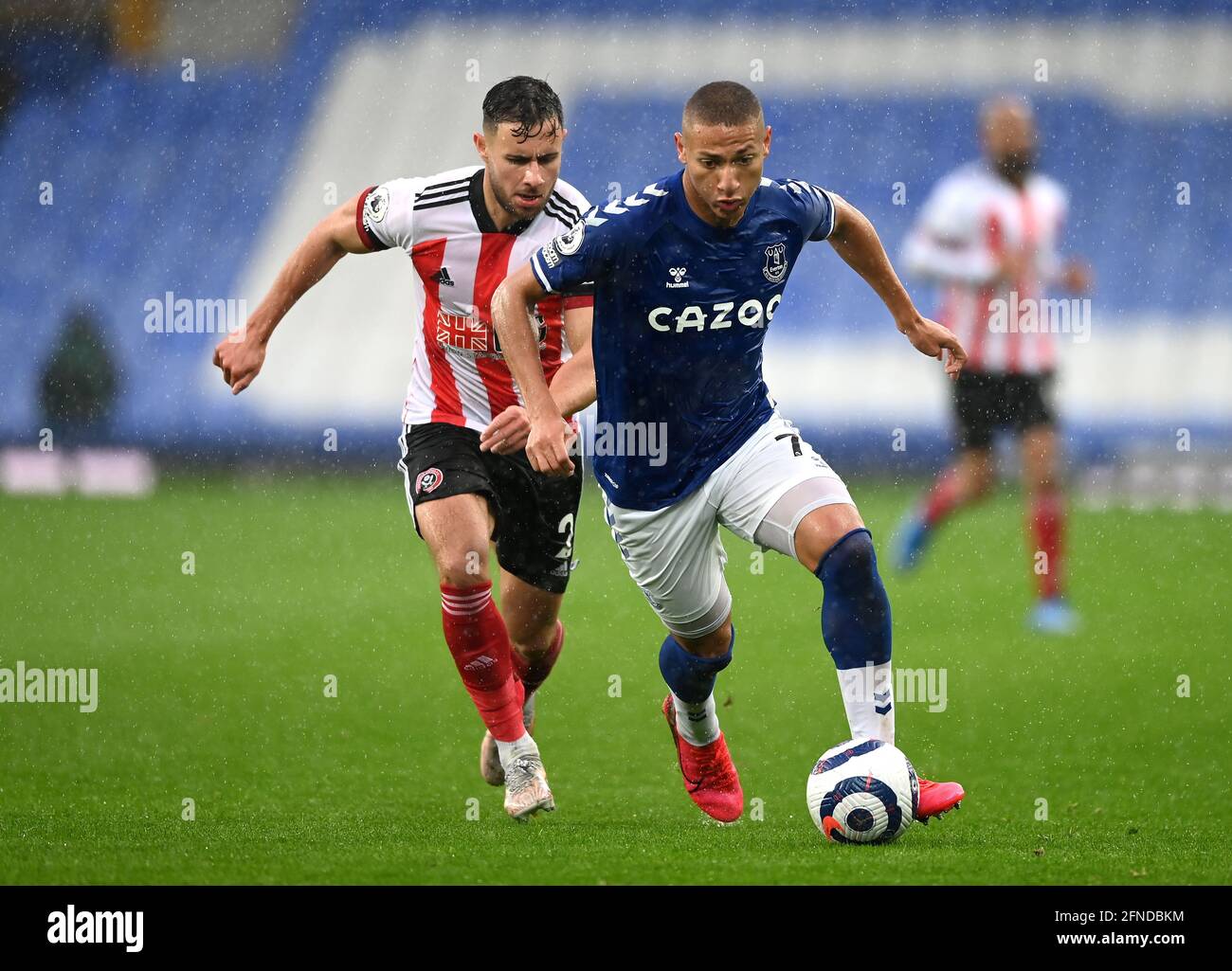 Sheffield United's George Baldock (left) and Everton's Richarlison battle for the ball during the Premier League match at Goodison Park, Liverpool. Picture date: Sunday May 16, 2021. Stock Photo