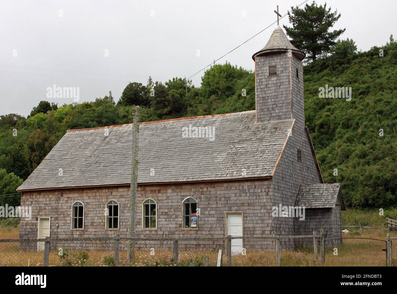 Wooden church in Caulin village, Chiloe Island, Chile Stock Photo