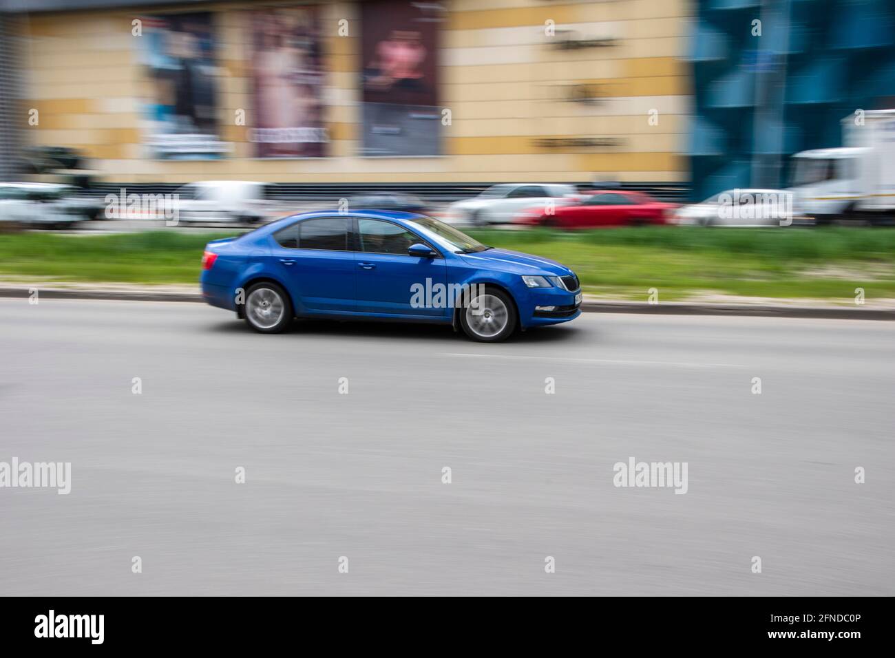 Ukraine, Kyiv - 26 April 2021: Blue Skoda Octavia car moving on the street. Editorial Stock Photo