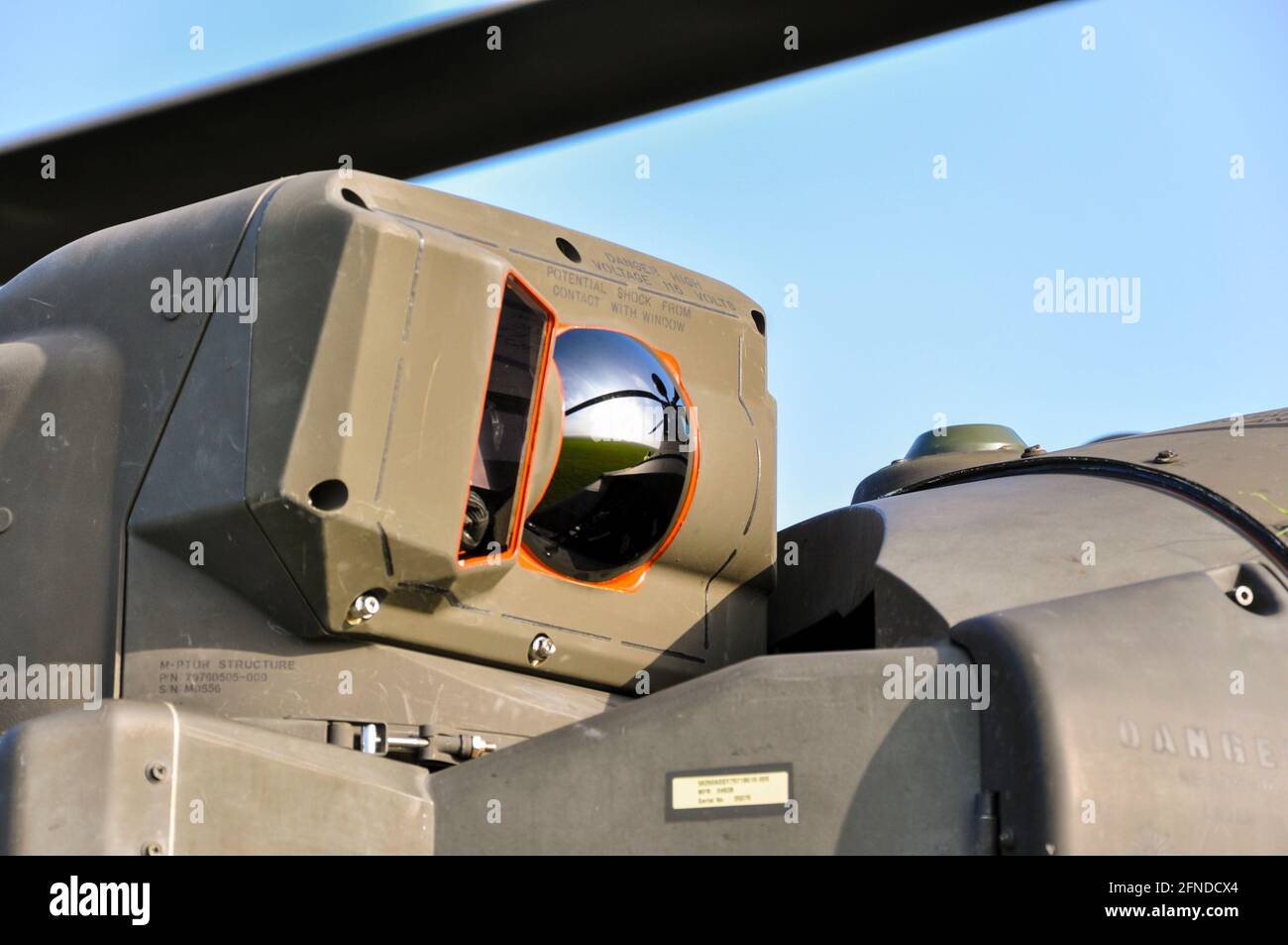 Detail of sensor on a AgustaWestland WAH-64 Apache gunship helicopter of the British Army, Army Air Corps. Pilot Night Vision Sensor, PNVS. Mirrored Stock Photo