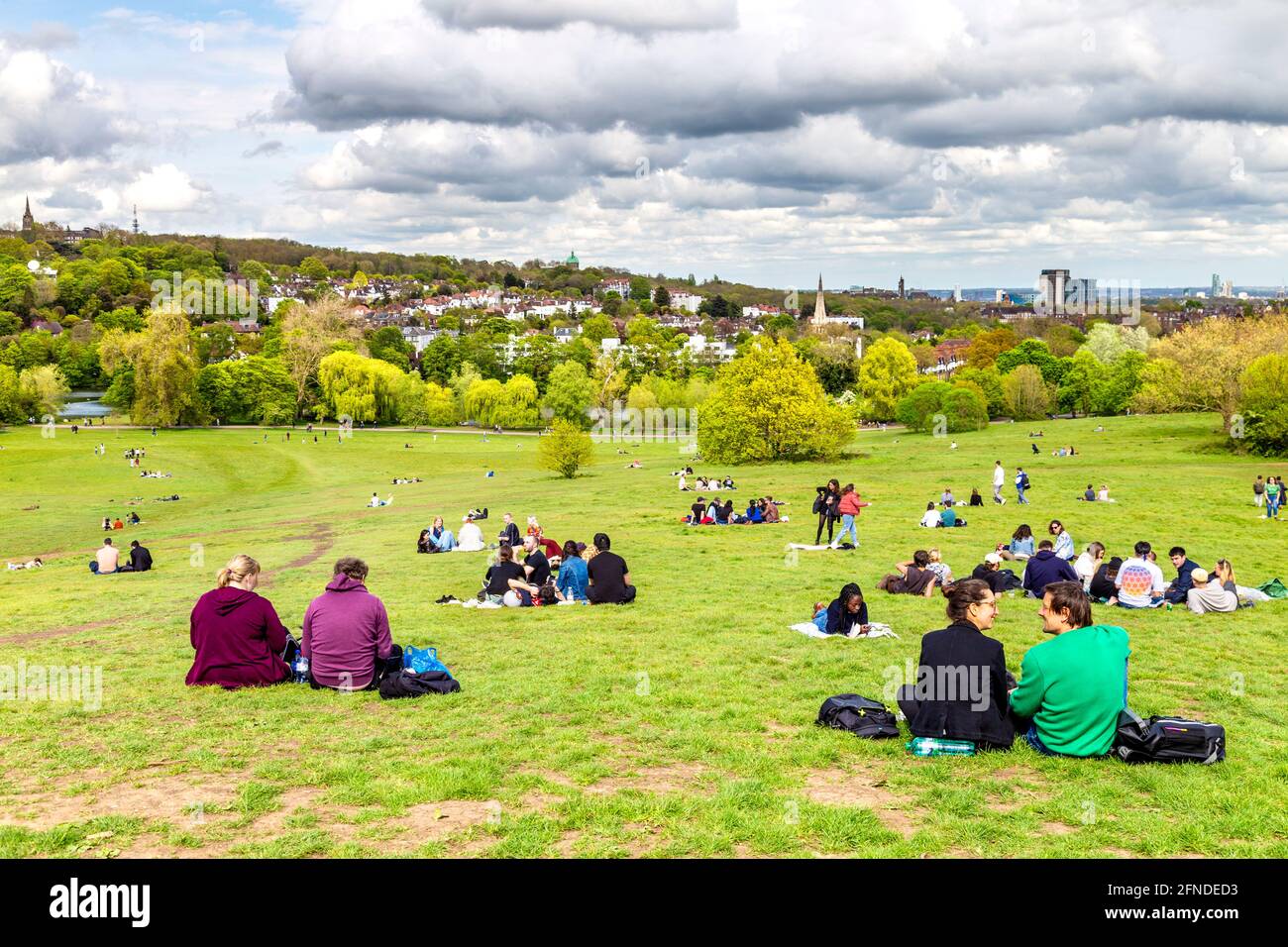 People picnicing at the Parilament Hill Viewpoint overlooking the Highgate Village, London, UK Stock Photo