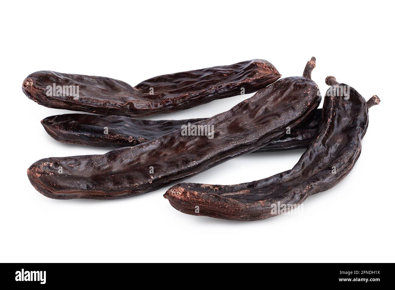 Ripe carob pods isolated on white background with clipping path and