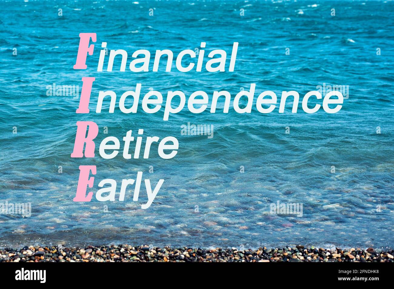 Seascape, concept of a calm serene life with the word fire, acronym for financial independence retire early Stock Photo