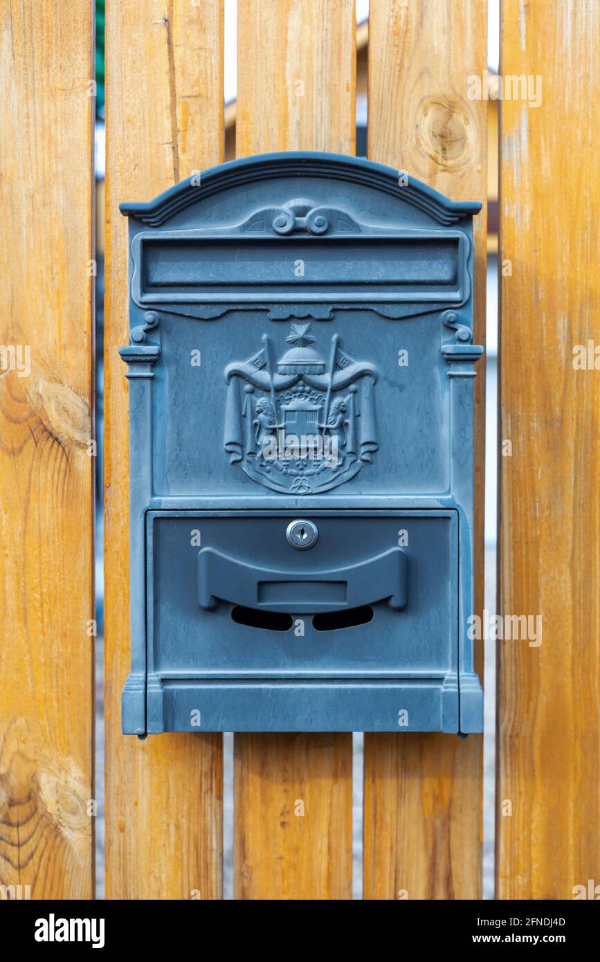 Mail metal black mailbox postbox on wooden Stock Photo