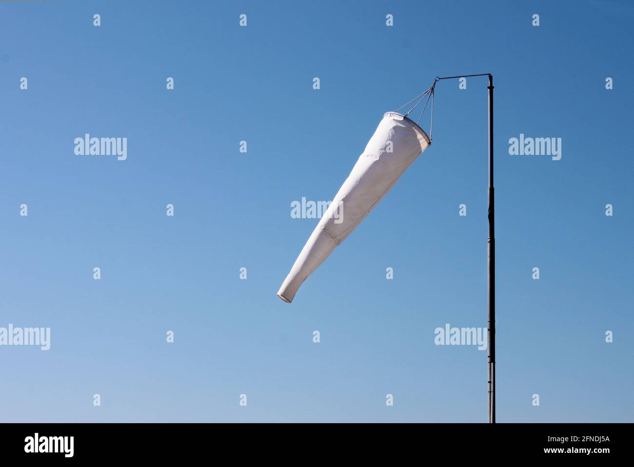 Windsock against a blue sky Stock Photo