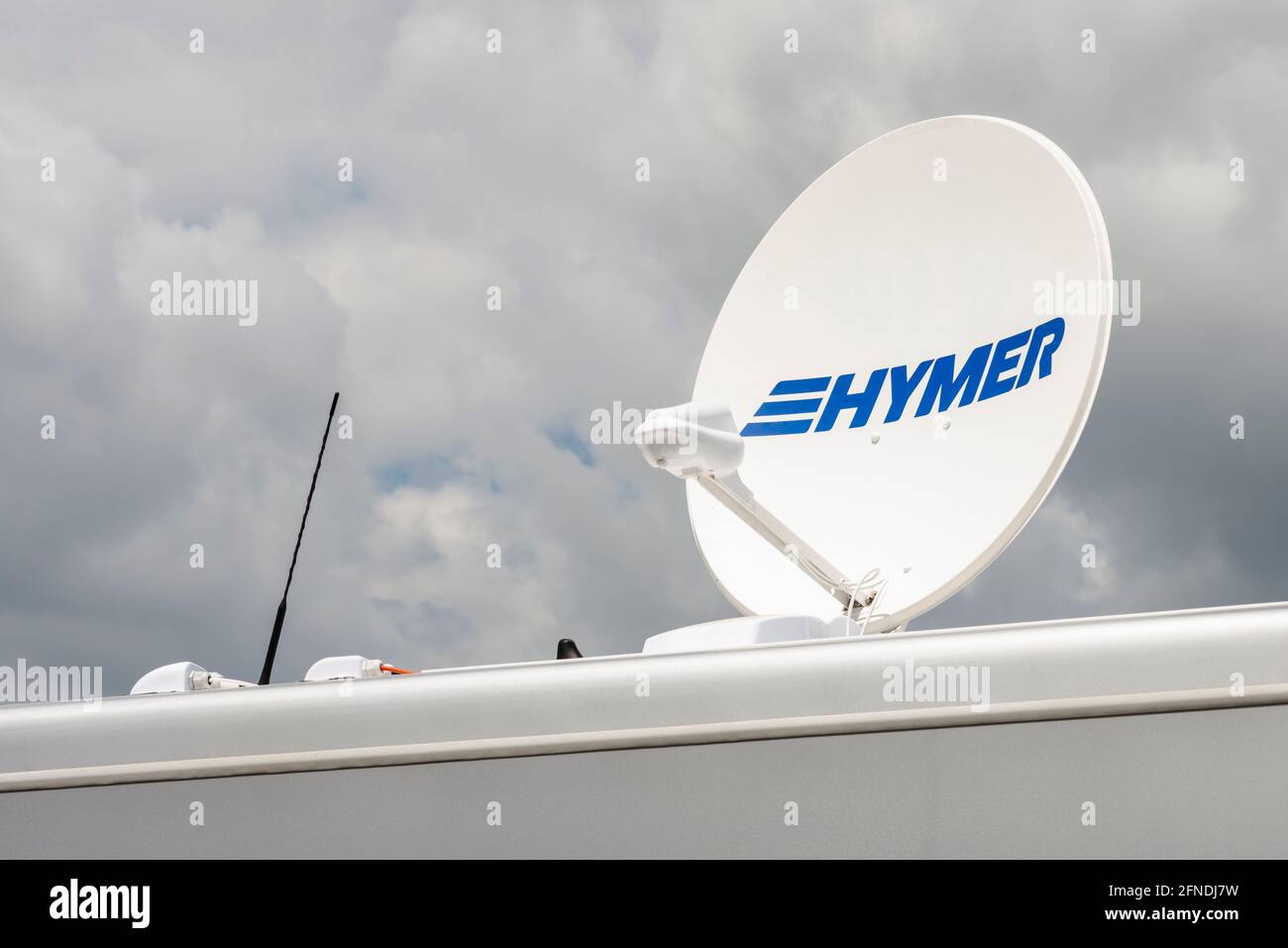 Camping and caravaning. Satellite dish or antenna reflector as Oyster Vision single satellite system on Hymer motorhome Stock Photo