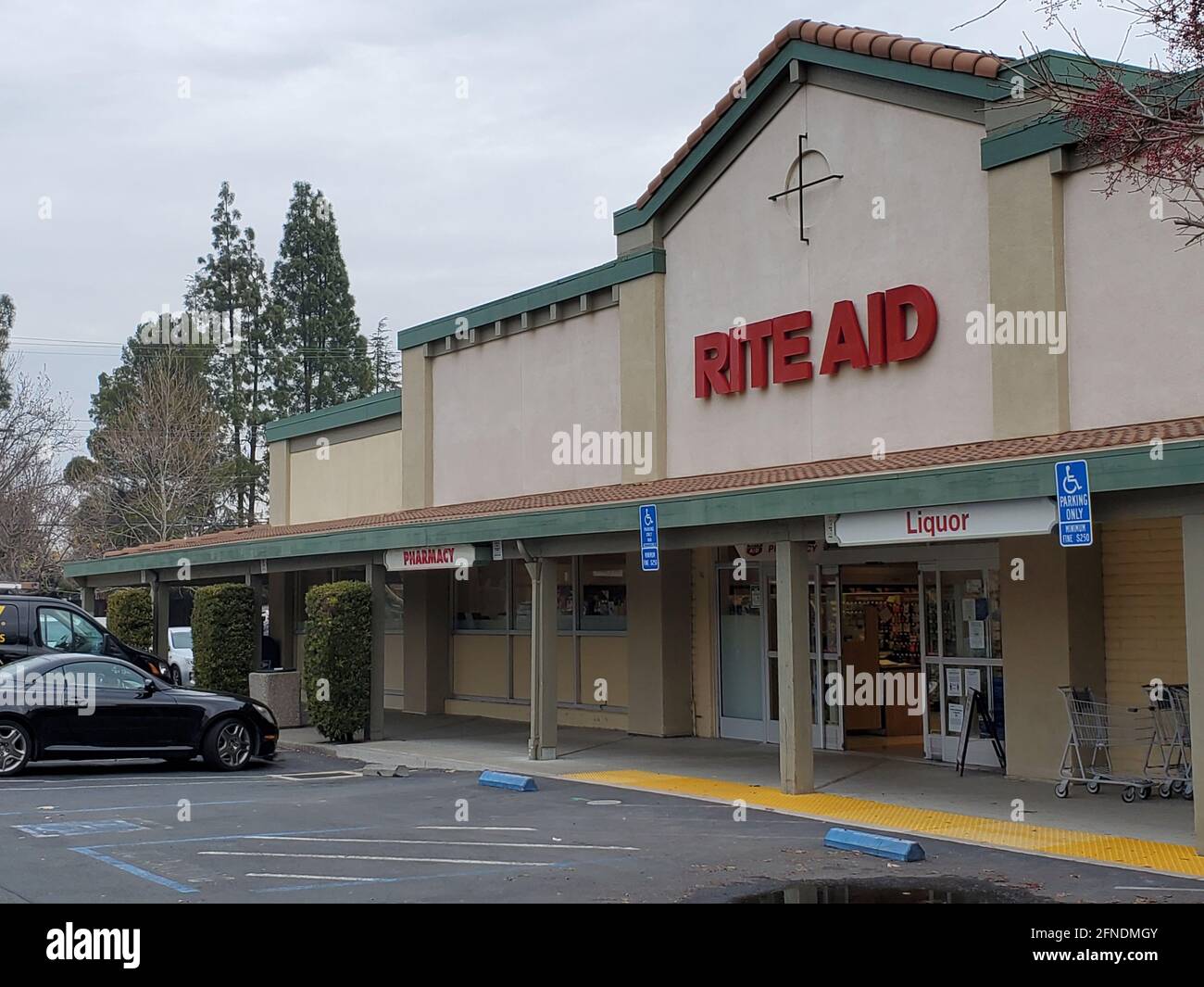 Side view of the entrance to the Rite Aid Drug Store with the sign