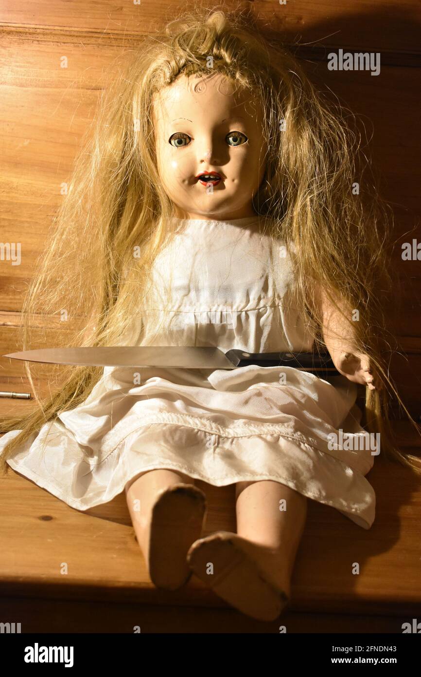 Creepy doll sitting on chair hires stock photography and images Alamy