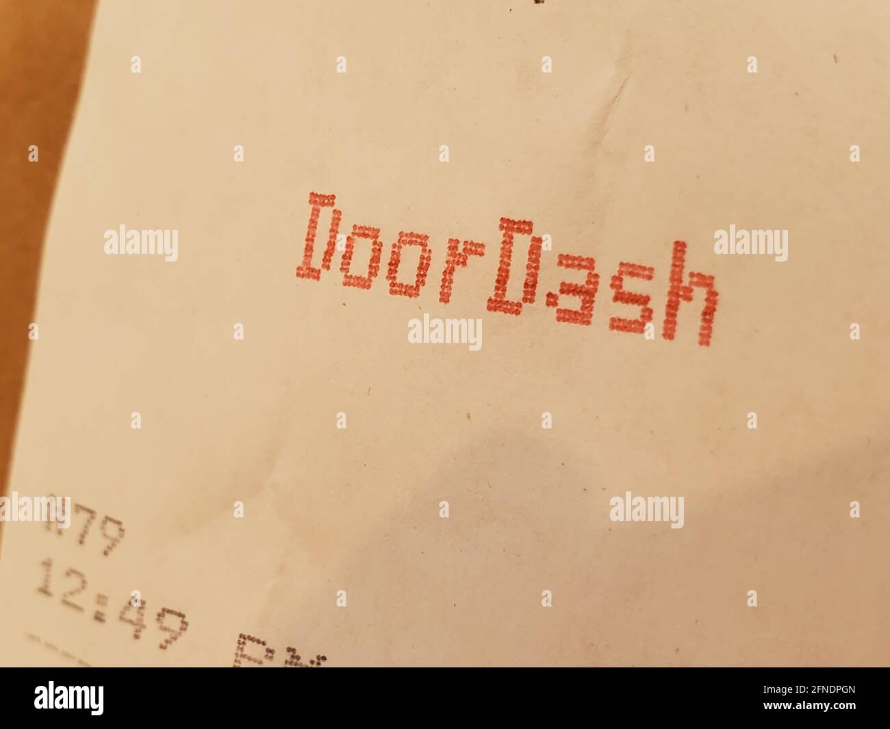 Close-up of a restaurant receipt with Doordash printed in red ...