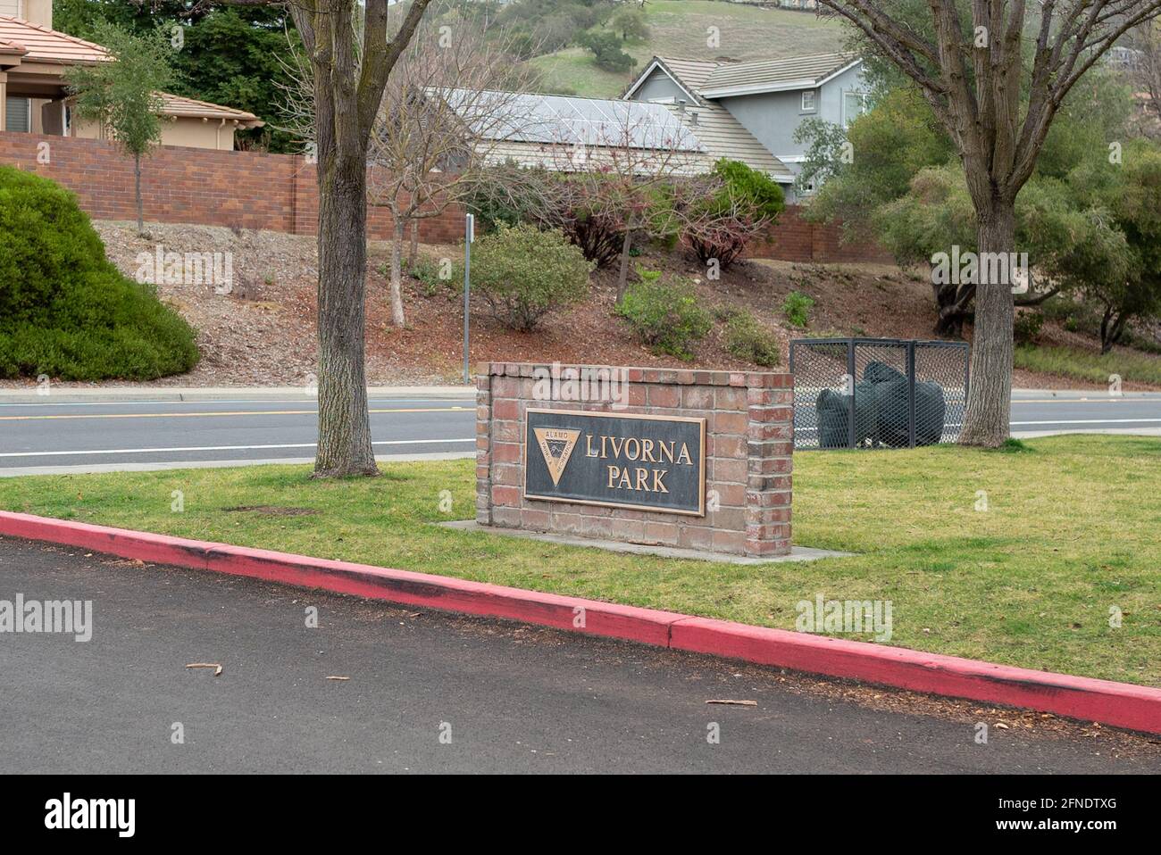 Side shot of the roadside sign for Livorna Park in Alamo, California