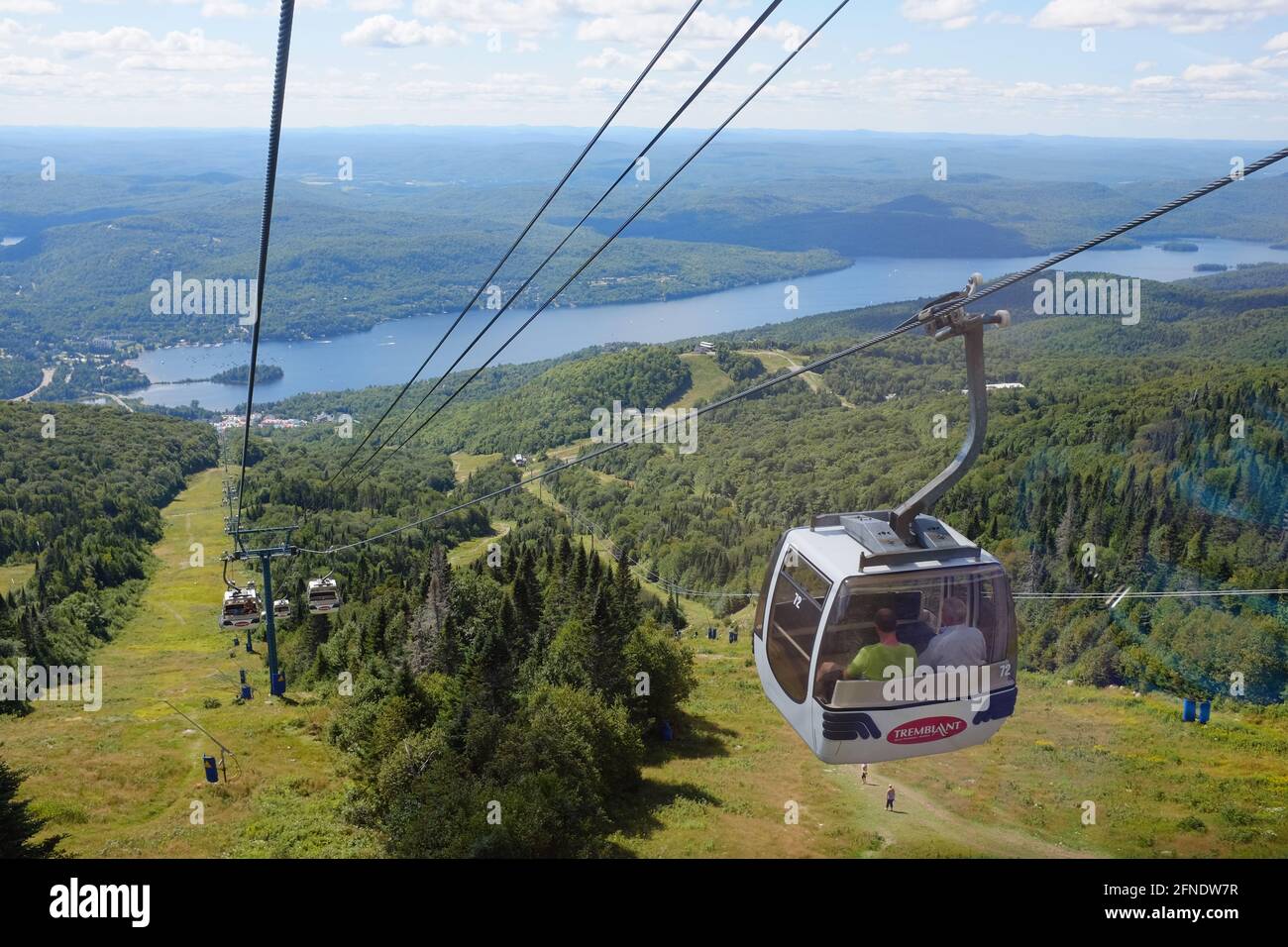 Cable car going down the mountain, with a panoramic view of Mont