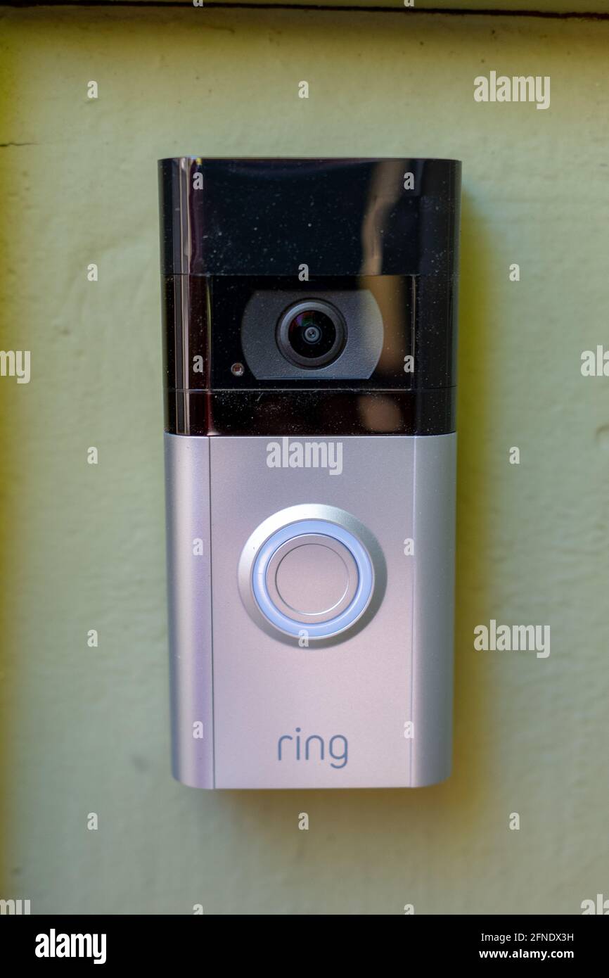 Close-up of a video doorbell with a 'Ring' logo attached to a light-colored wall, February 17, 2021. () Stock Photo