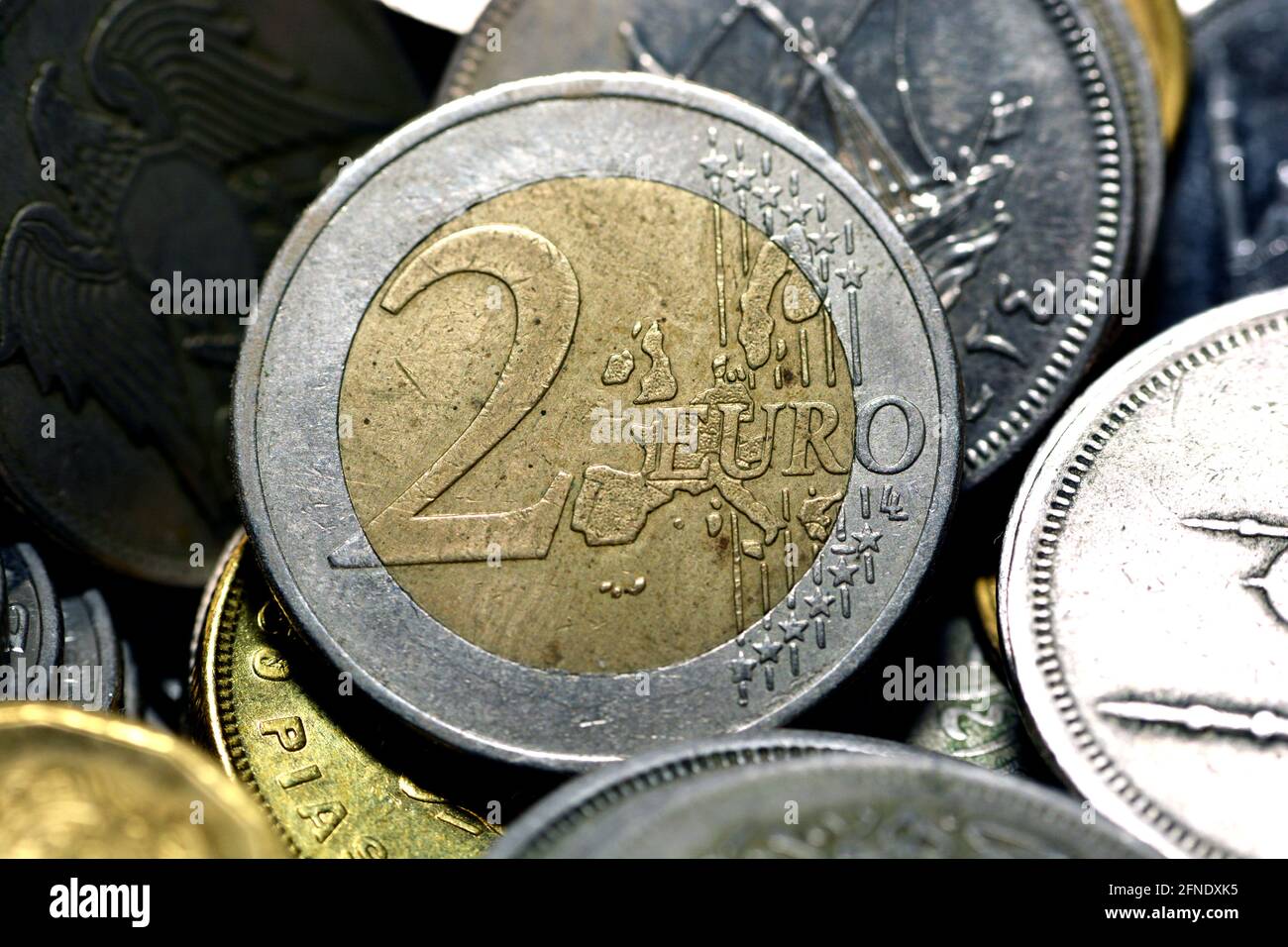 The 2 euro coin (€2) closeup with different coins background, The coin