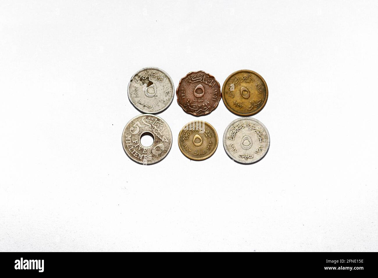 collection of old Egyptian money coins of 5 Milliemes background, different shapes of old Egyptian five Milliemes coin from different years isolated Stock Photo